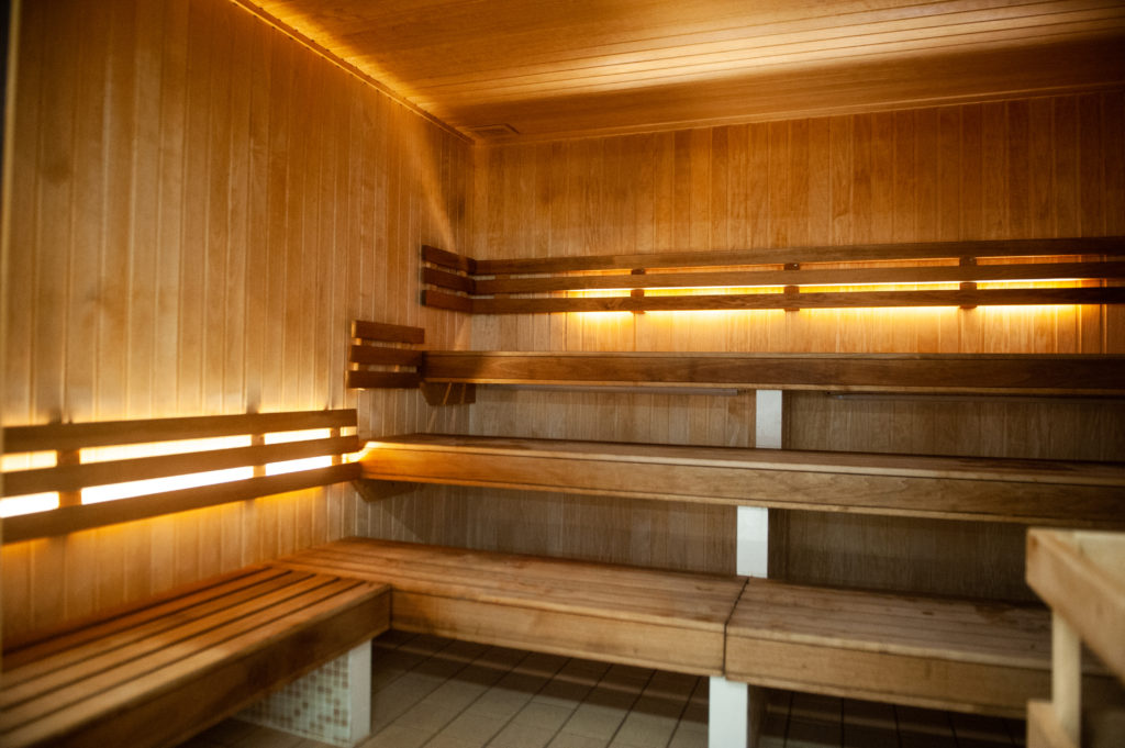 Poolside sauna with timber benches